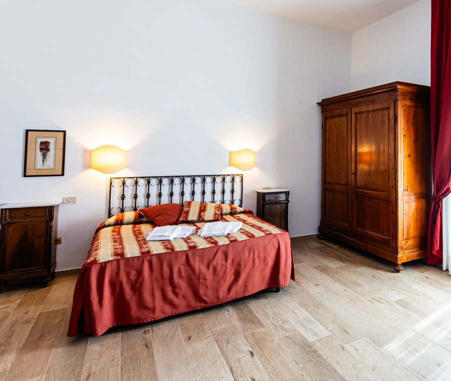 Room 15 at Fattoria Il Palagio, a double with two single beds, sleeping four